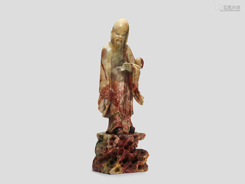 A soapstone figure of a Shoulao on rockwork pedestal Qing dynasty, probably late 18th century-Early 19th century