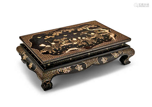 A mother-of-pearl-inlaid black lacquer low table, kang 17th/18th Century