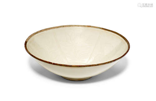 A carved and molded Dingyao hexafoil 'goose, lotus and fish' dish Song/Jin Dynasty