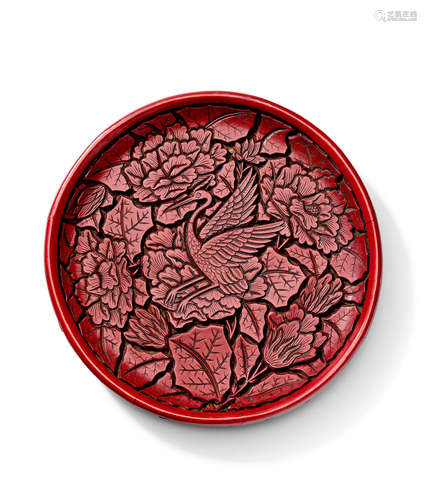 A Ming carved cinnabar circular 'Crane or Egret' dish 15th Century