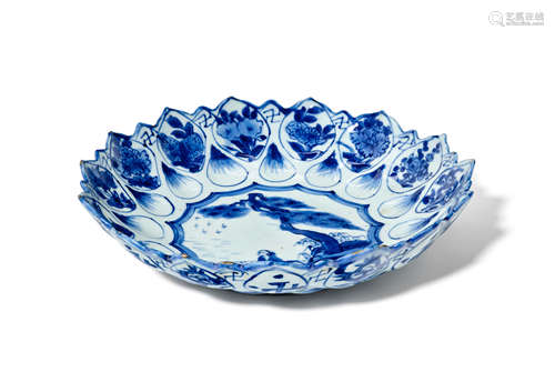 A blue and white lotus-petal-molded 'pine and boat' dish Chenghua Mark, Wanli/Tianqi (1573-1627)