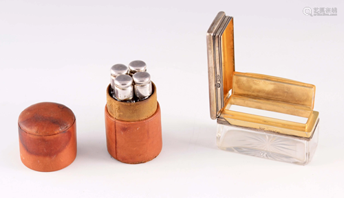 A SET OF FOUR CASED TRAVELLING SILVER TOPPED SCENT