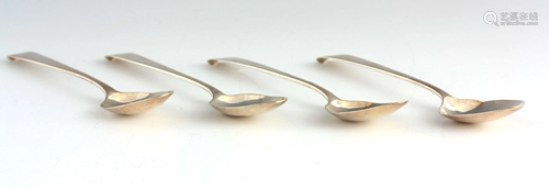 A SET OF FOUR GEORGE III IRISH CRESTED DESSERT SPOONS