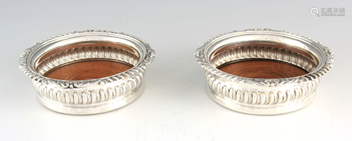 A PAIR OF GEORGE IV CRESTED SILVER WINE COASTERS with