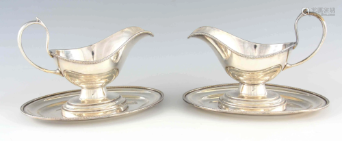 A LARGE PAIR OF 19TH CENTURY SILVER PLATED SAUCE BOATS