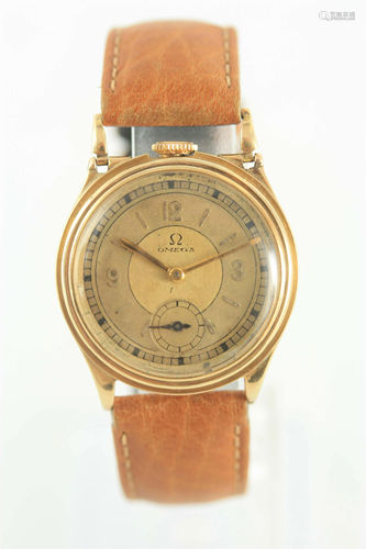 AN UNUSUAL GOLD 1930'S TOP WINDING OMEGA WRIST WAT…