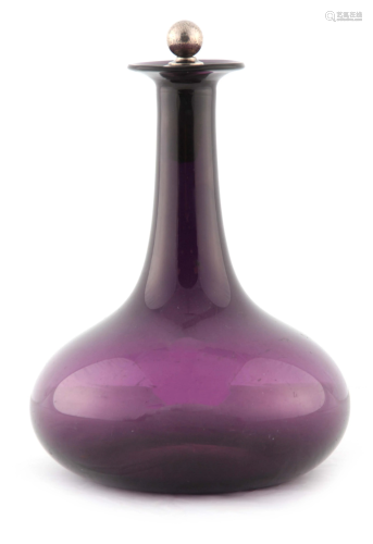 AN AMETHYST GLASS PORT DECANTER WITH SILVER METAL