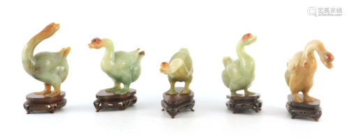 A SET OF FIVE CHINESE GREEN JADE GEESE STANDING ON
