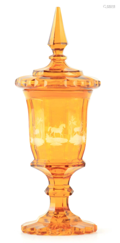 A 19TH CENTURY BOHEMIAN AMBER GLASS VASE AND COVER the