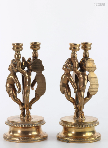 Arman Fernandez Angelots Pair of gilded candlesticks