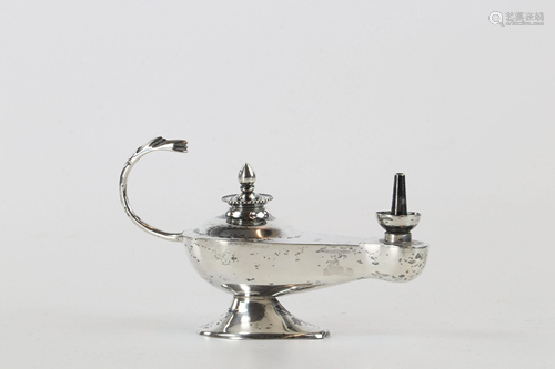 Silver oil lamp, the socket ending in a dragon's head