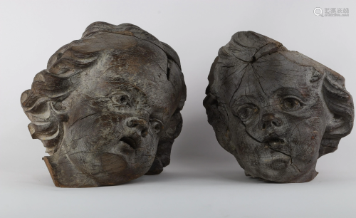 Putti heads in carved wood, Baroque period (accidents