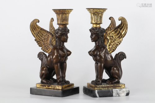 Pair of empire candlesticks with sphinxes in bronze
