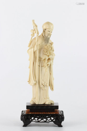 China sculpture of a sage carrying a flower and a stick