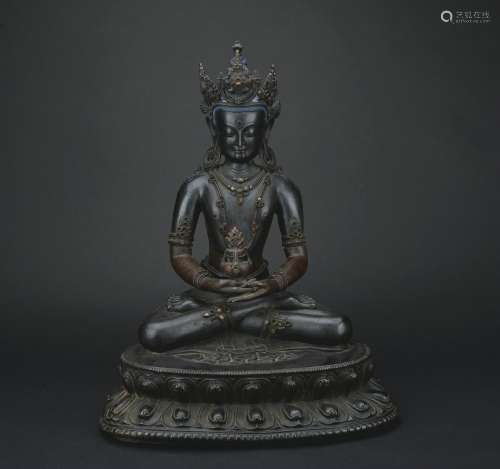 A bronze statue of Medicine Buddha