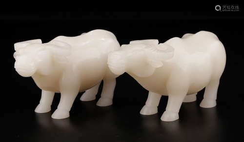 PAIR OF HETIAN JADE BULL SHAPE PENDANTS