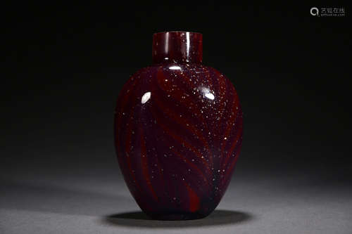 A PURPLISH RED GLASSWARE SNUFF BOTTLE