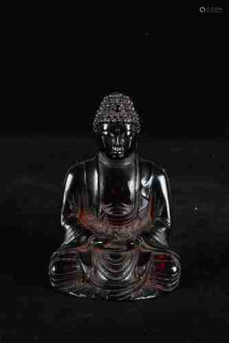 A CHINESE AMBER BUDDHA STATUE, QING DYNASTY