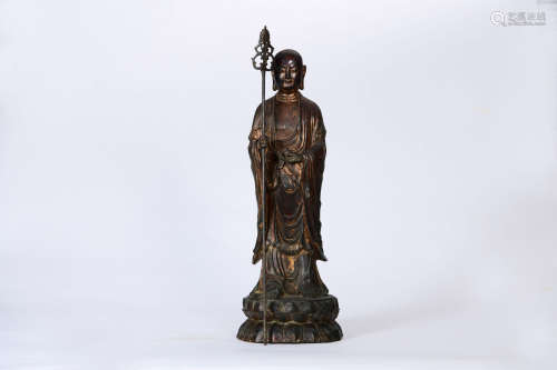 A COPPER STANDING KSHITIGARBHA STATUE
