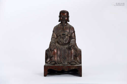 A COPPER SITTING PAK TAI STATUE