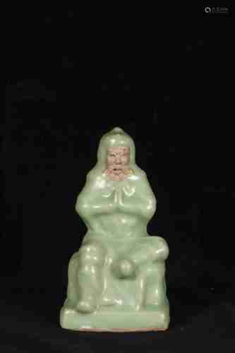 A CHINESE LONGQUAN KILN FIGURE STATUE, MING DYNASTY