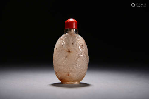 A CARVED DRAGON AND PHOENIX CRYSTAL SNUFF BOTTLE