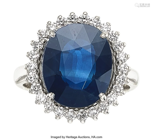 11099: Sapphire, Diamond, White Gold Ring The ring fea