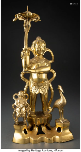 78138: A Chinese Gilt Bronze Child Buddha Candlestick,