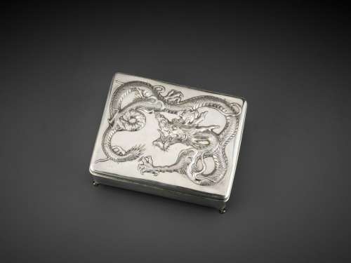 A SILVER REPOUSSE ‘DRAGON’ BOX AND COVER, WANG HING, LATE QING TO REPUBLIC