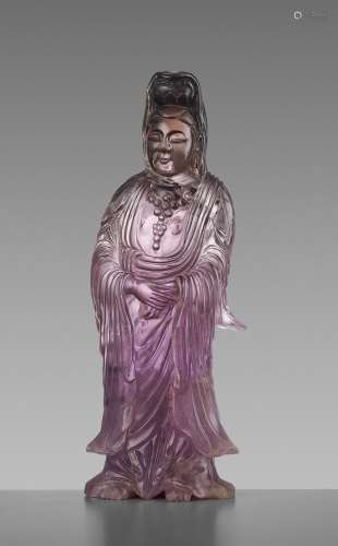 A CARVED AMETHYST FIGURE OF GUANYIN, QIANLONG MARK AND OF THE PERIOD
