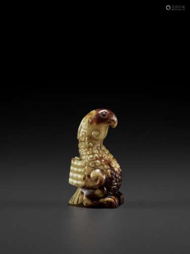 A YELLOW AND RUSSET JADE FIGURE OF A PHOENIX, EASTERN ZHOU