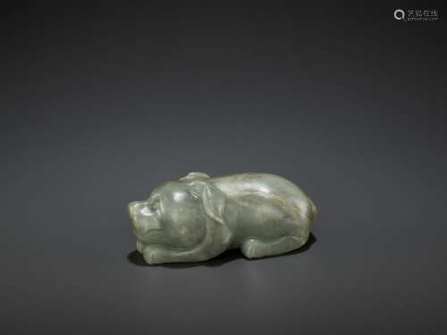A CARVED CELADON AND RUSSET JADE FIGURE OF A DOG, LATE MING DYNASTY