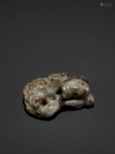 AN OPENWORK JADE GROUP OF A BUDDHIST LION AND CHILONG, MING DYNASTY