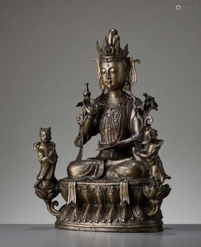 A LARGE AND MASSIVE BRONZE TRIAD OF AVALOKITESHVARA AND TWO ACOLYTES, MING TO EARLY QING