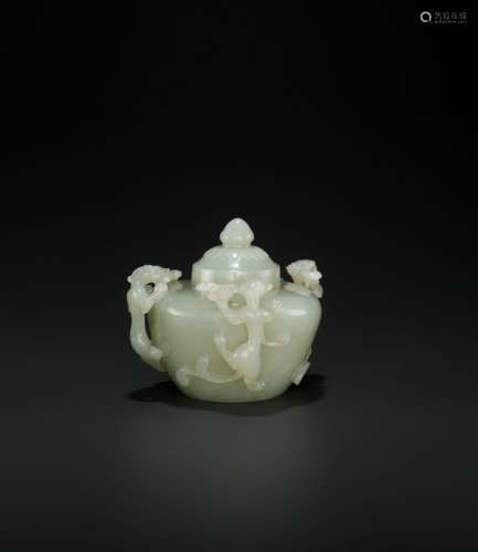 AN OPENWORK PALE CELADON JADE ‘CHILONG’ WATER POT AND COVER, QING