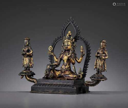 A GILT BRONZE TRIAD OF A FEMALE DEITY AND HER ACOLYTES