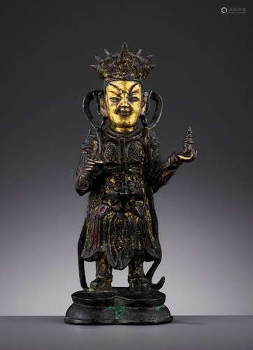 A PARCEL-GILT BRONZE FIGURE OF VAISRAVANA, MING DYNASTY