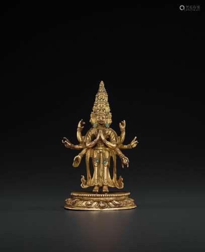 A GILT-BRONZE FIGURE OF EKADASHAMUKHA AVALOKITESHVARA, 18TH CENTURY