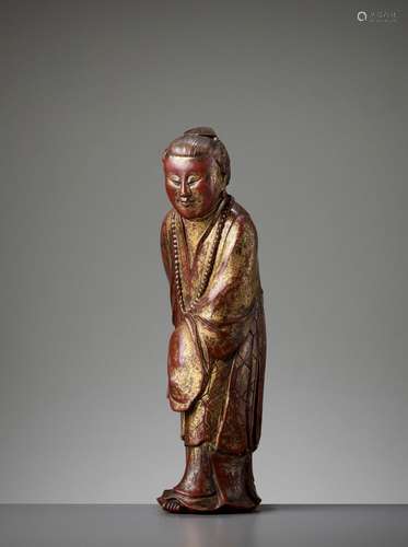 A GILT AND LACQUERED WOOD FIGURE OF A BUDDHIST PRIEST, LATE MING