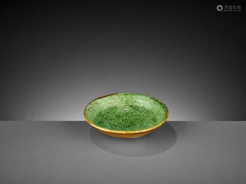 A MOLDED GREEN AND AMBER-GLAZED POTTERY DISH, LIAO DYNASTY