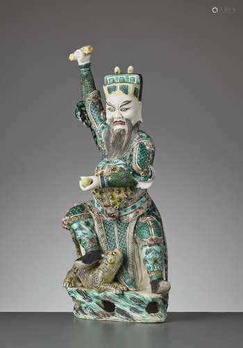 A FAMILLE VERTE BISCUIT FIGURE OF CAISHEN IN WRATHFUL GUISE, KANGXI