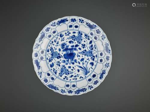 A BARBED AND MOLDED ‘LOTUS’ DISH, KANGXI MARK AND PERIOD