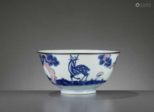 A COPPER-RED-DECORATED BLUE AND WHITE ‘DEER’ BOWL, QIANLONG MARK AND PERIOD