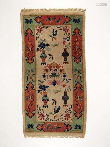 A WOOL RUG, LATE QING TO REPUBLIC