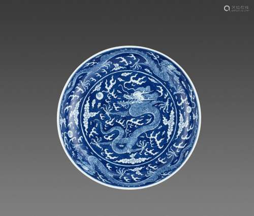 A BLUE AND WHITE REVERSE-DECORATED “DRAGON” DISH, DAOGUANG MARK AND PERIOD