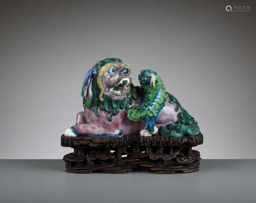 A BISCUIT PORCELAIN MODEL OF A BUDDHIST LION AND CUB, QING DYNASTY