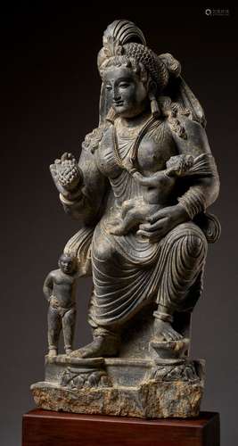 A HIGHLY IMPORTANT AND LARGE SCHIST STATUE OF HARITI, GANDHARA, 2ND-3RD CENTURY