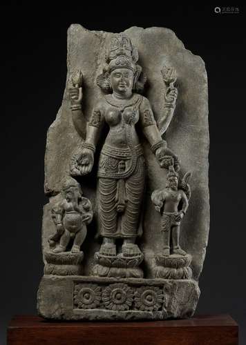 AN IMPORTANT STONE STELE OF PARVATI WITH HER SONS GANESHA AND SKANDA