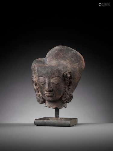 A TERRACOTTA HEAD OF A DEITY, MAJAPAHIT