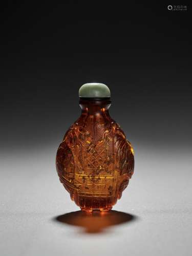 A GOLD-SPLASHED AMBER GLASS ‘DOUBLE ELEPHANT’ SNUFF BOTTLE, POSSIBLY IMPERIAL, QING DYNASTY
